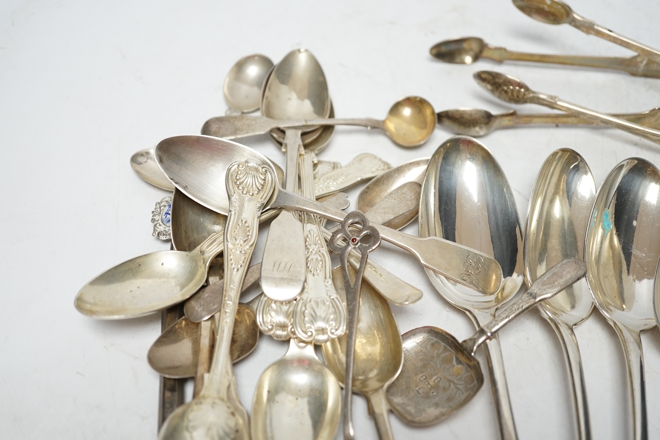 A small quantity of assorted silver flatware including a pair of George III silver Old English pattern table spoons by Elizabeth Tookey, London, 1767 and a set of three similar table spoons by Eley & Fearn, London, 1808,